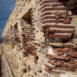 Brick detail from the line of embrasures in the rampart wall Castello Maniace — Ortigia Island.