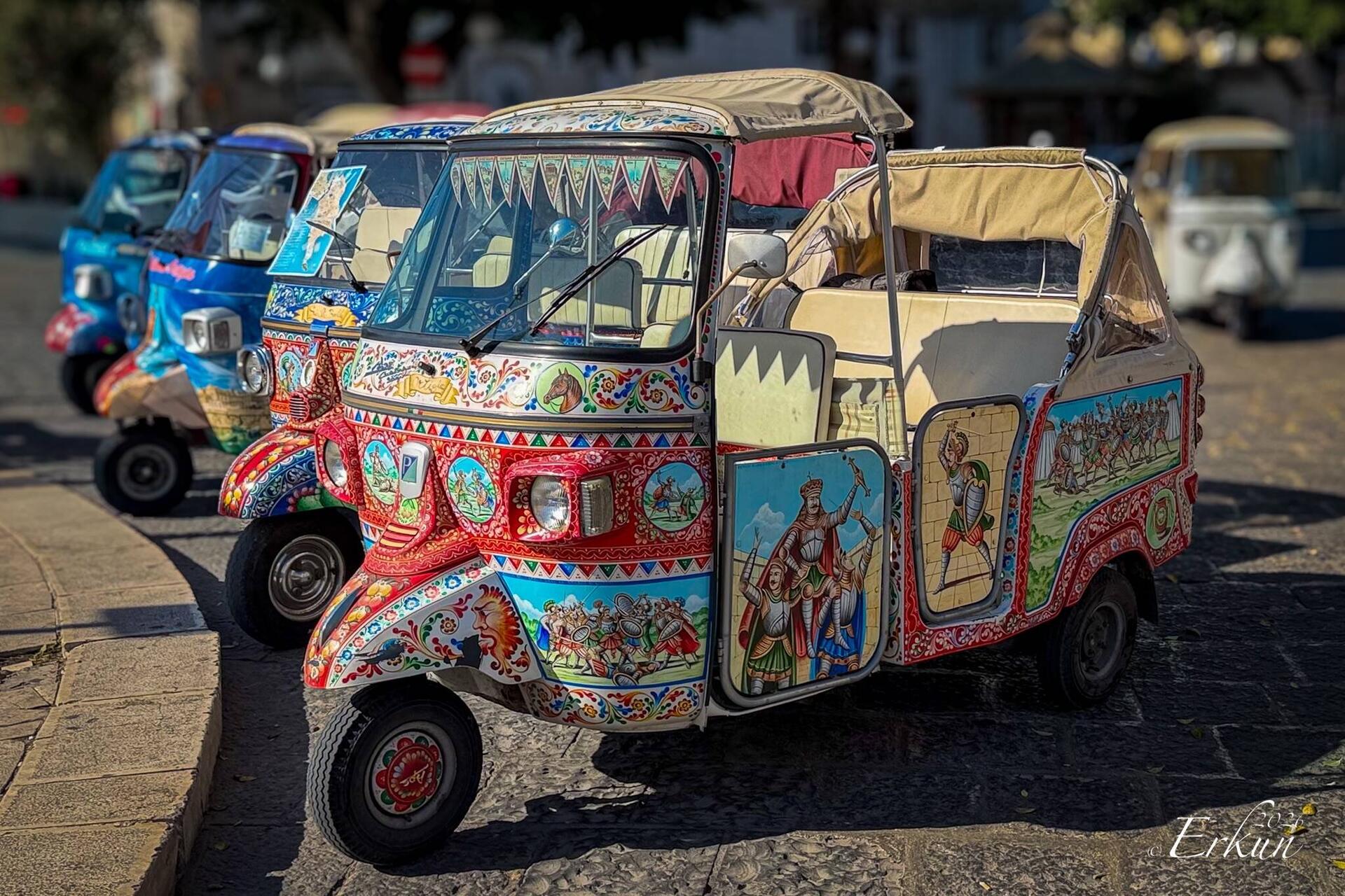 Decorated Piaggio Ape cars waiting for customers ... near the Ortigia Market.