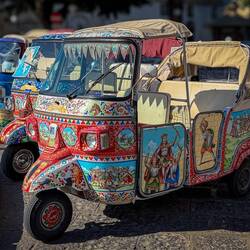 Decorated Piaggio Ape cars waiting for customers ... near the Ortigia Market.