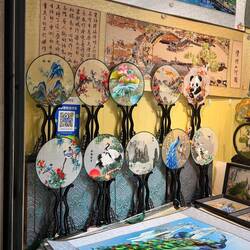 These fans are HAND embroidered - watched a woman make one