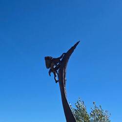 A sculpture representing the "ancient ones" who would have to climb into their homes carrying goods.
