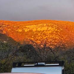 The sun reflects off the opposite side of the valley.