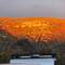 The sun reflects off the opposite side of the valley.