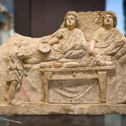 Limestone relief depicting a banquet scene ... 3rd century BCE.