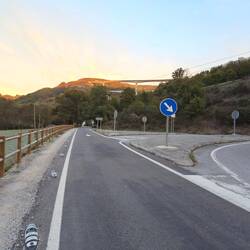 Sunlight showing high up over the motorway and the Nacional