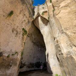 Ear of Dionysius ... Mui provides perspective for the size of the opening.