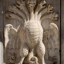 Mythical, multi-headed serpentine hydra dragon ... on the base of the Charles V Monument.